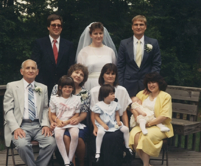 Janie with Mike and George on her Wedding Day, Reston, VA. June 24, 1989. Len and me with Maureen, Judy with Kelly, and Tessie with Johanna on her lap