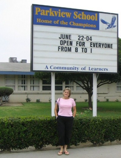 Judy outside her old school